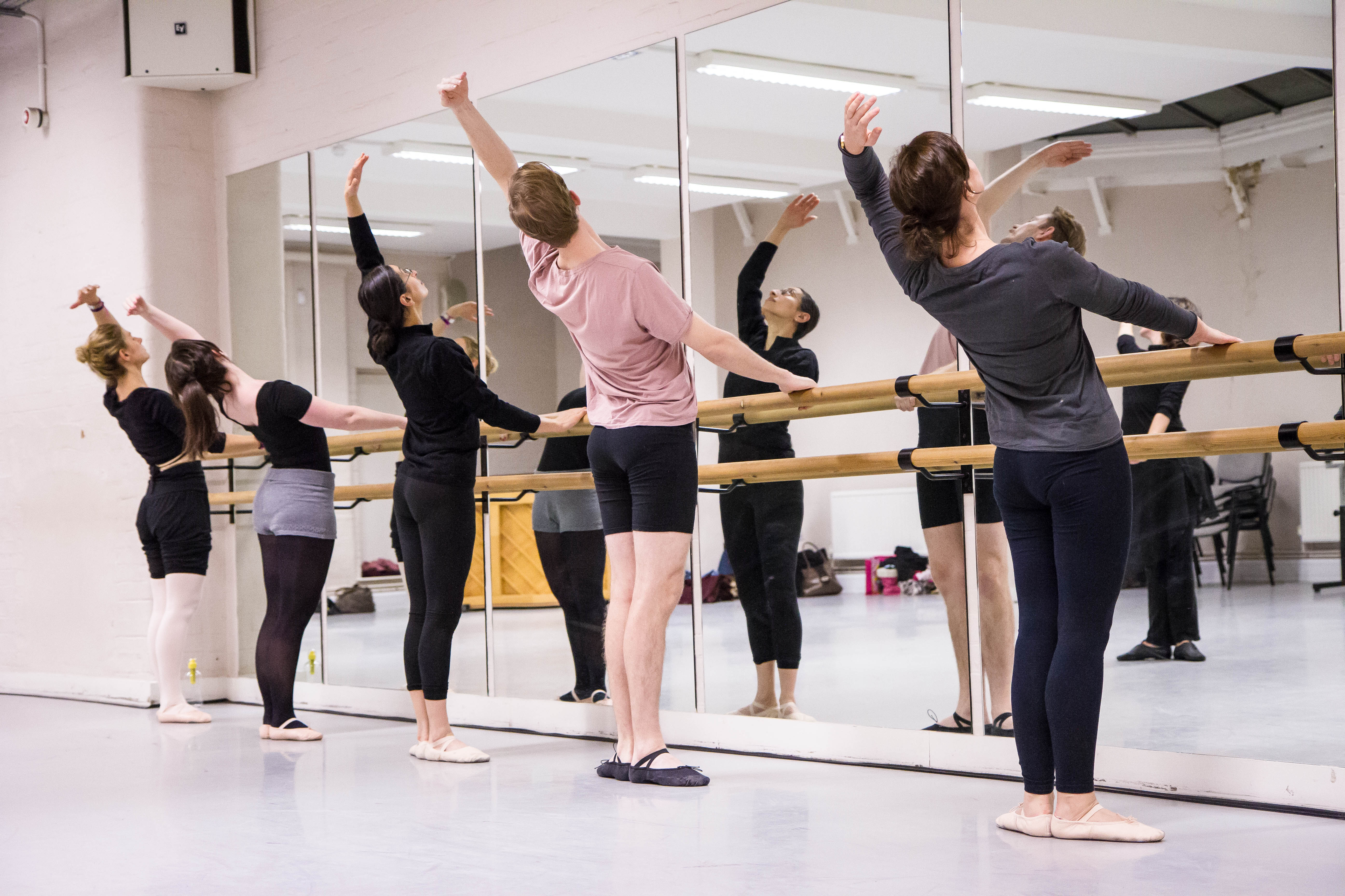 A ballet class practicing at the barre in one of our Beginner classes.