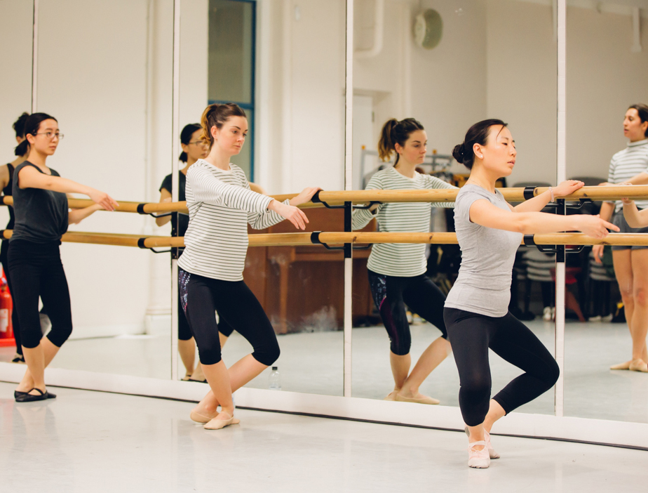 Dancer in a ballet attitude pose in a graceful classical dance - path  included Stock Photo - Alamy