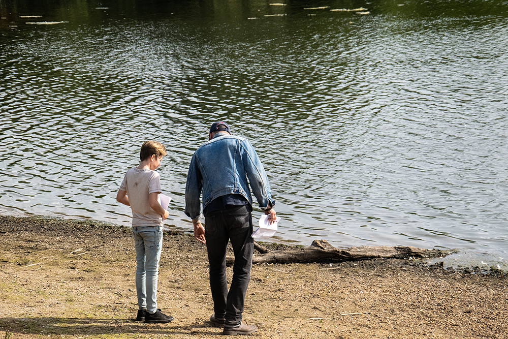 Lead actor Joel and director Tom on location discussing a scene