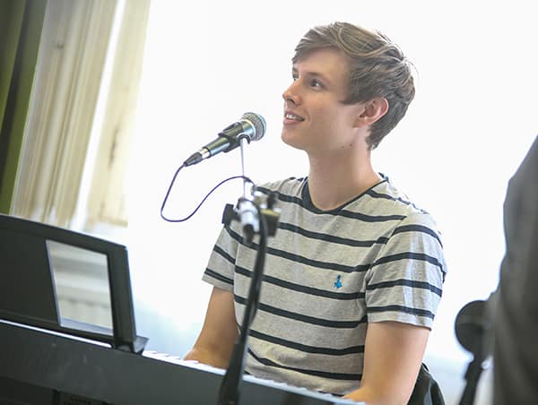 Elliot leading a City Academy Singing Lesson Elliot leading a Singing Lesson